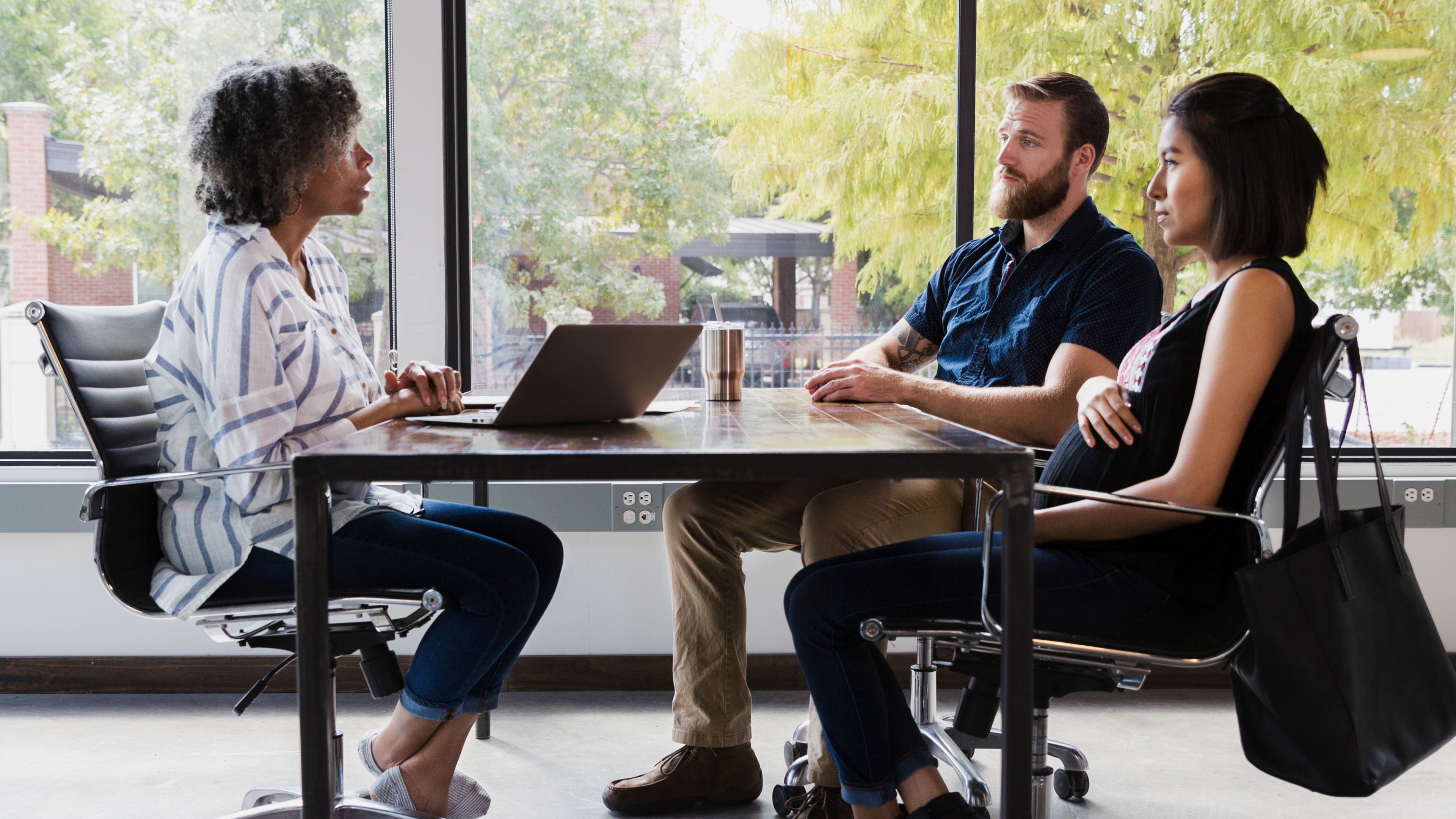 people around a table discussing financial services marketing